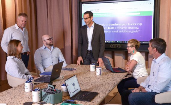 Group of people in a conference room talking