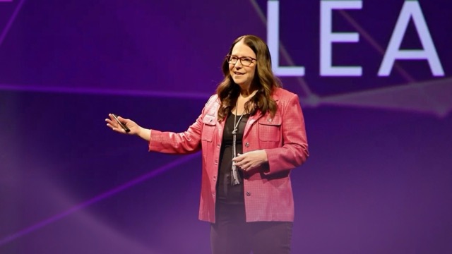 A video thumbnail titled "How to lead with intentional optimism: Inspire your team to explore, take risks, and grow" with colorful wave patterns and a play button in the center. Karrikins Group branding appears on the image.
